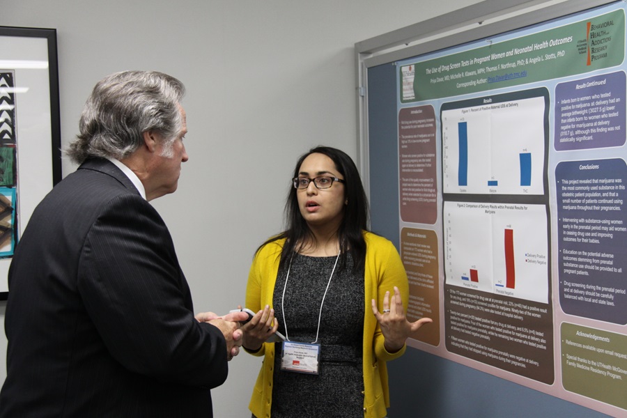 Dr. Cass discussing poster presentation