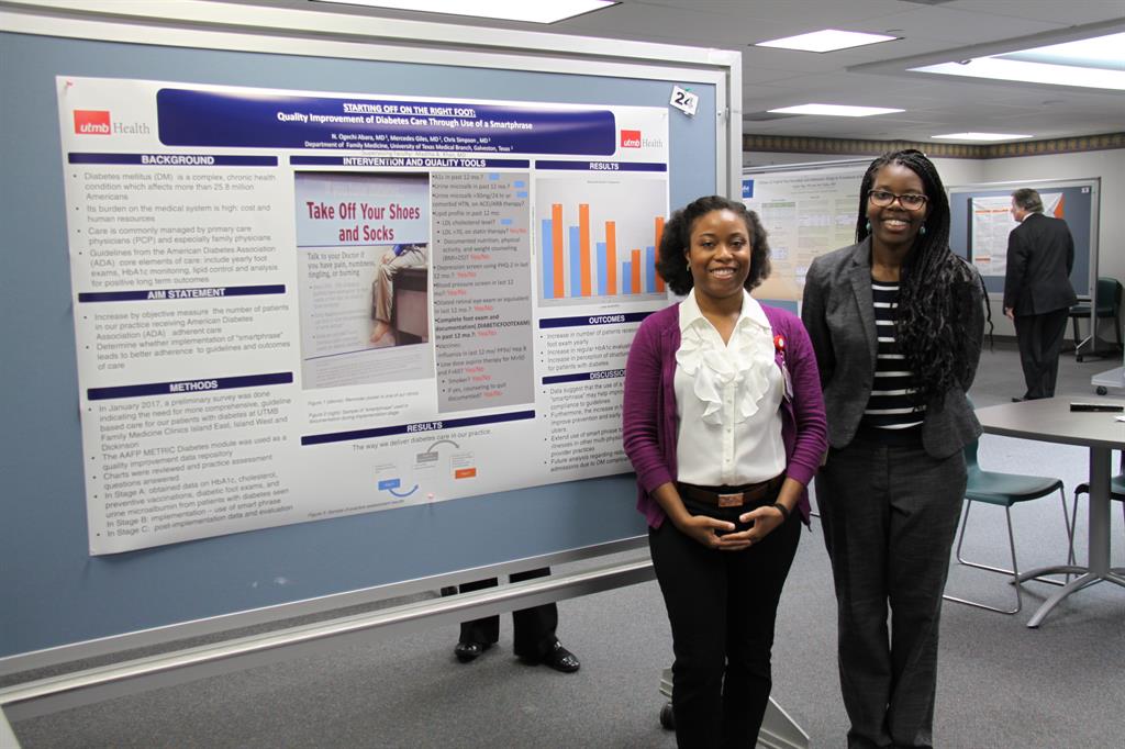 Dr. Giles and Dr. Abarra present poster at Annual Research Symposium